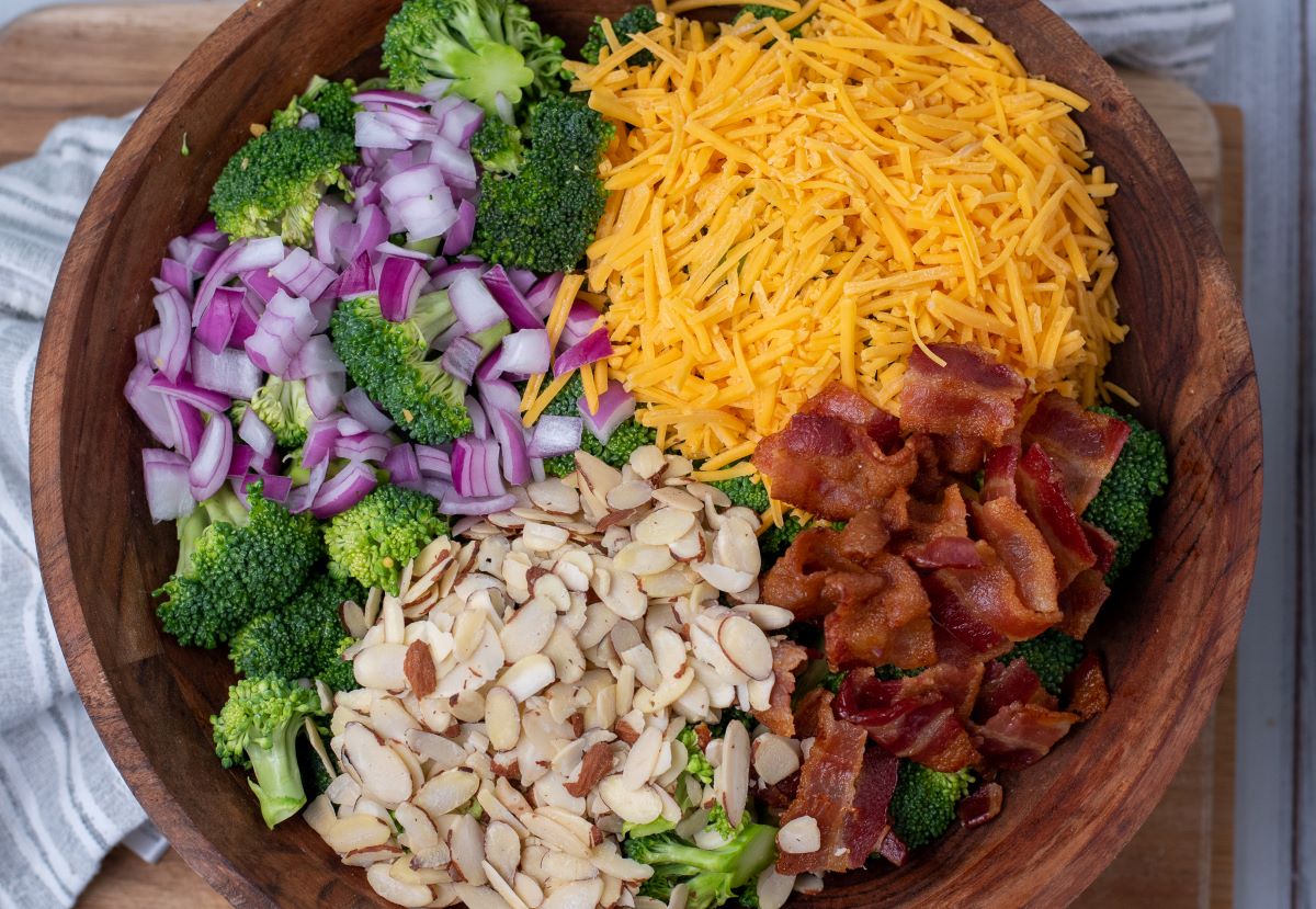 broccoli salad ingredients in wooden bowl