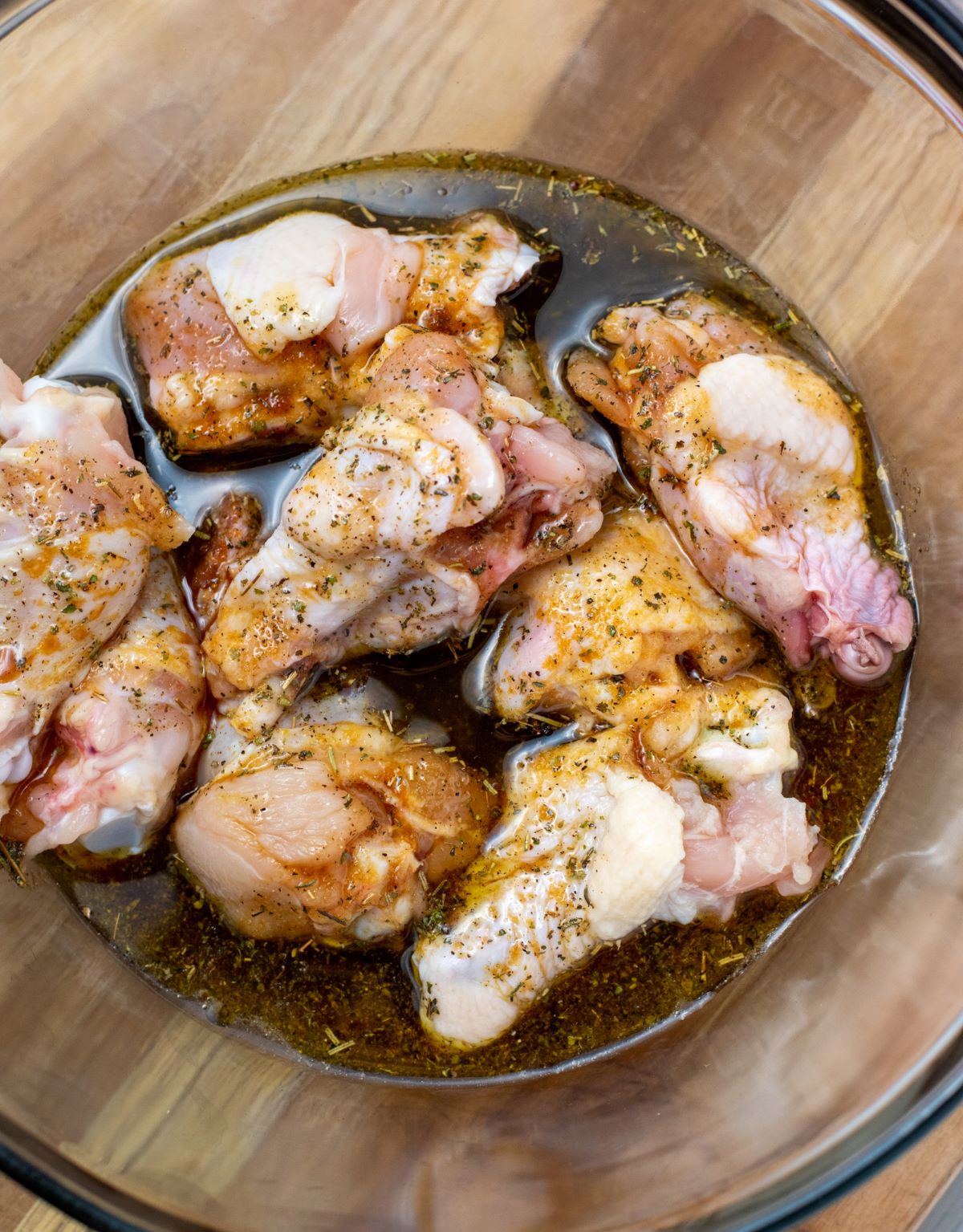 chicken wings in bowl with marinade