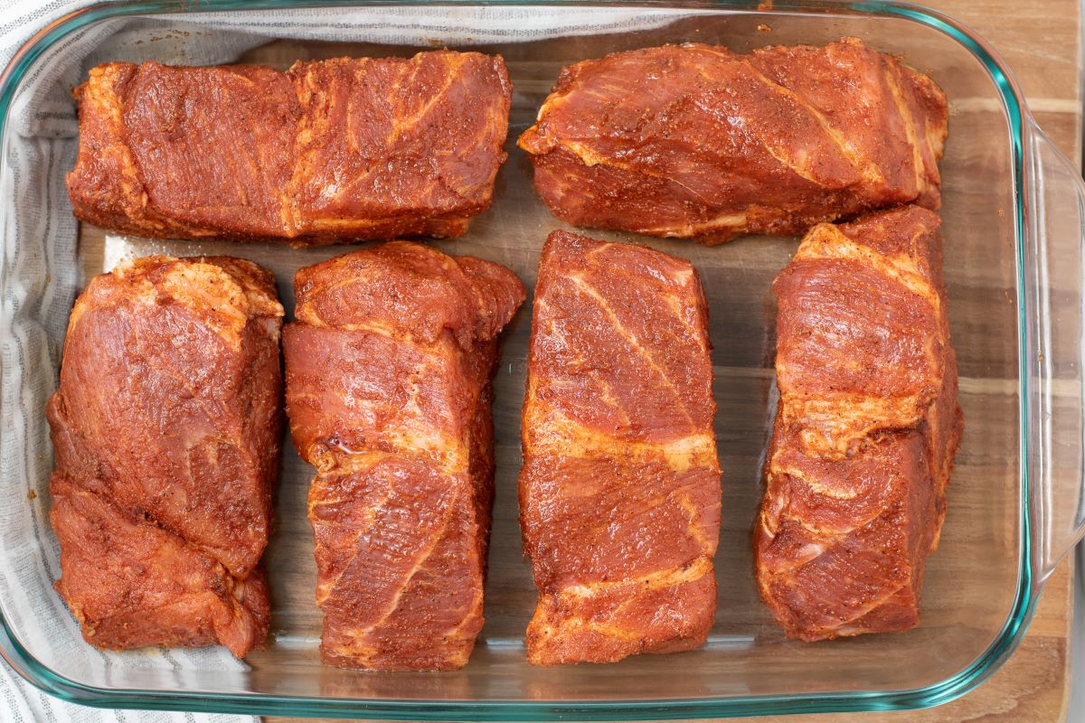 boneless pork ribs arranged in casserole dish