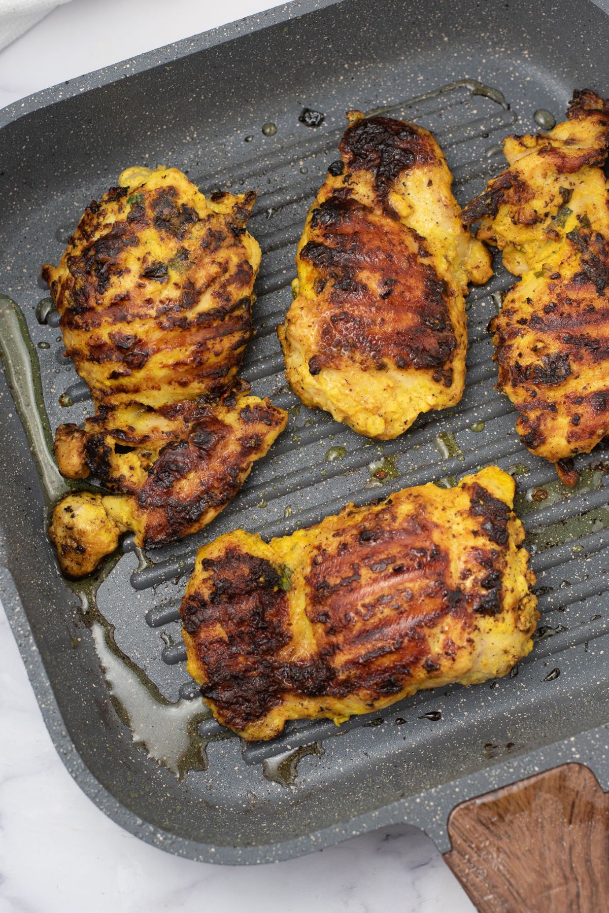 cooked chicken in grill pan
