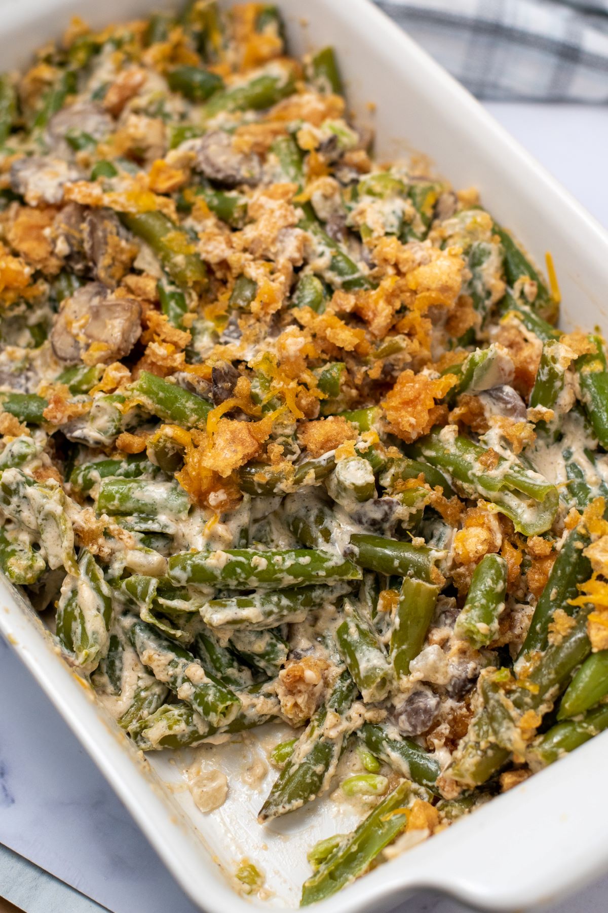 keto green bean casserole topped with pork rinds